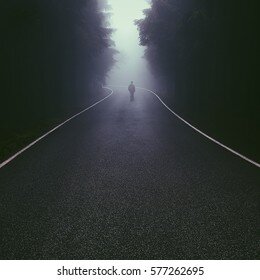 lonely-man-walking-down-foggy-260nw-577262695.jpg